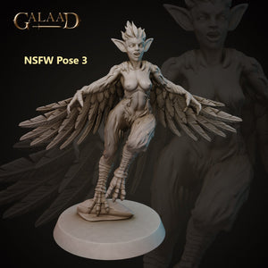 a statue of a woman with wings on top of a table