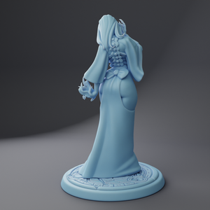 a figurine of a woman in a blue dress