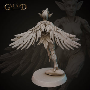 a statue of an angel with wings on a pedestal